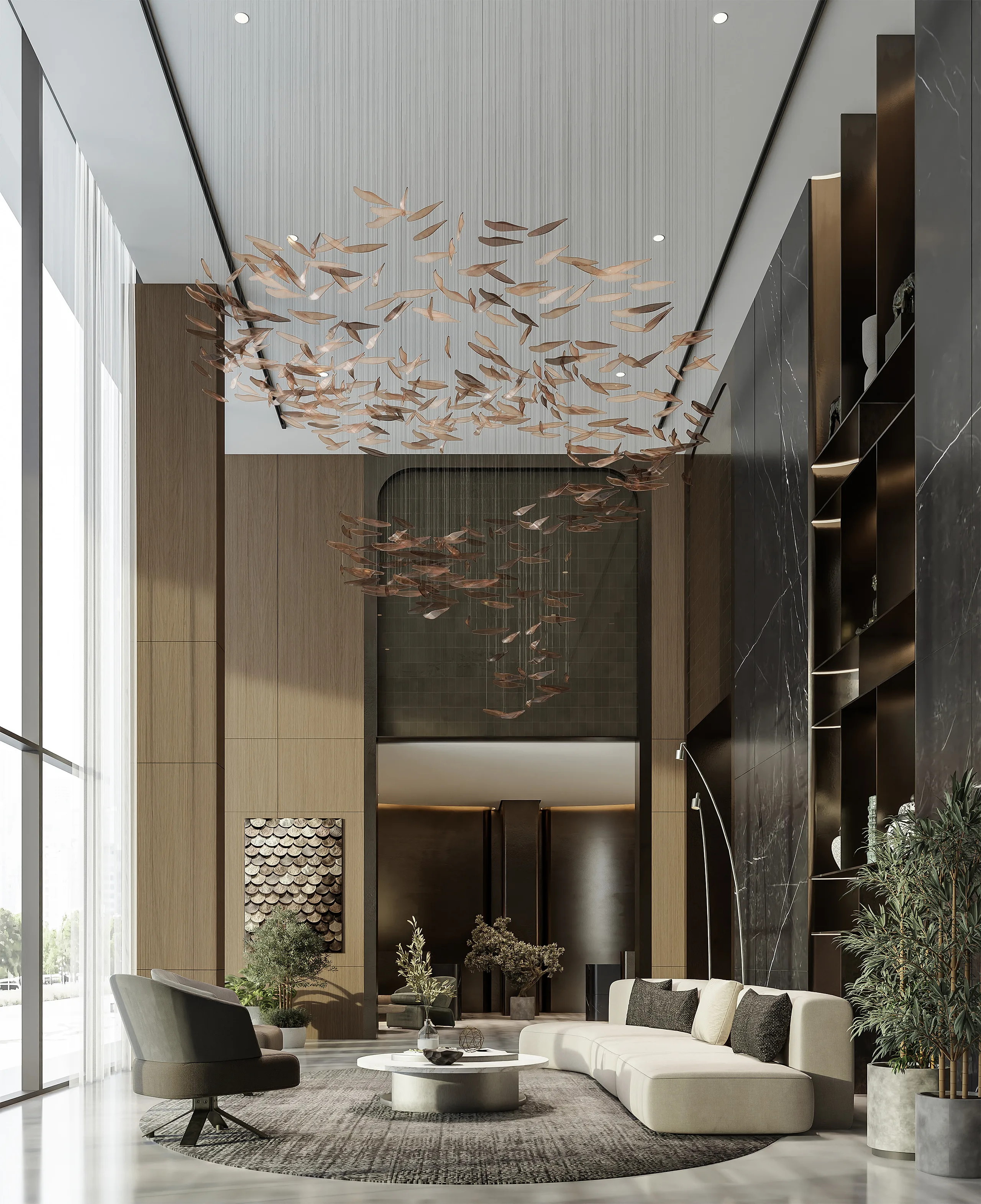 Double-height lobby with a bronze leaf chandelier above a cream sofa