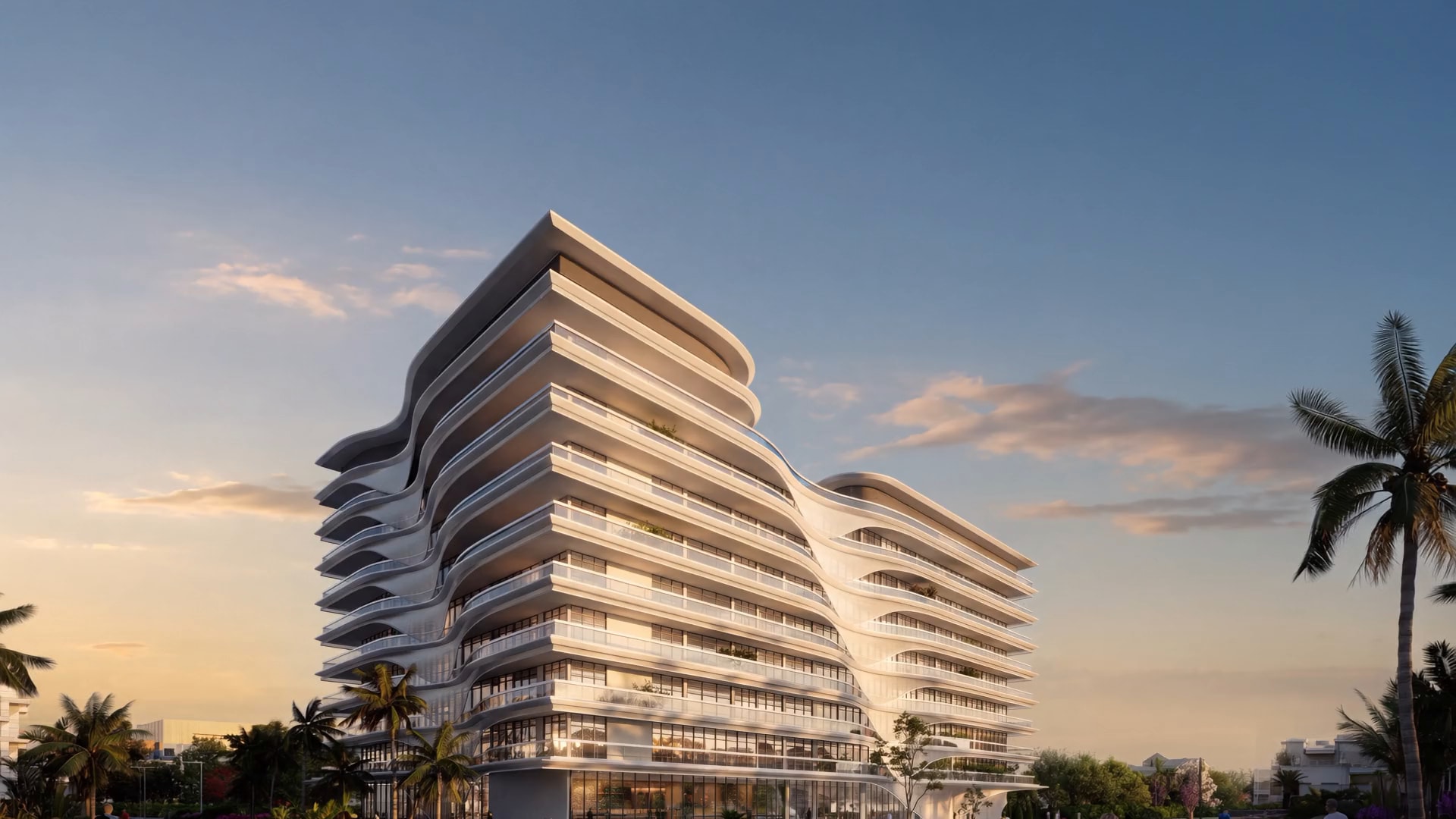 Bond Enclave at dusk, a tower of soft white curved terraces rising over palms