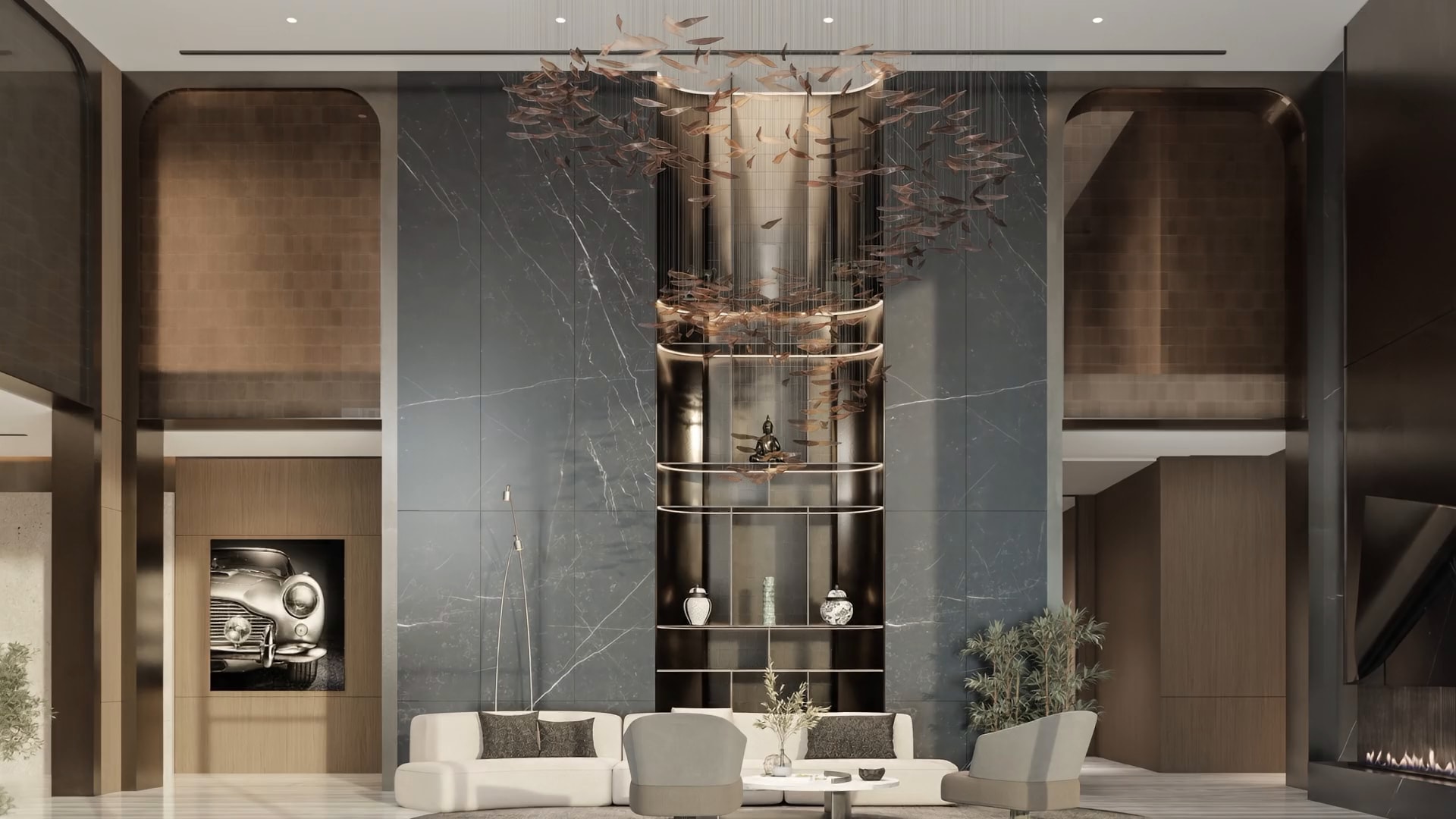 Double-height lobby with a bronze leaf chandelier over a black marble wall and a cream sofa
